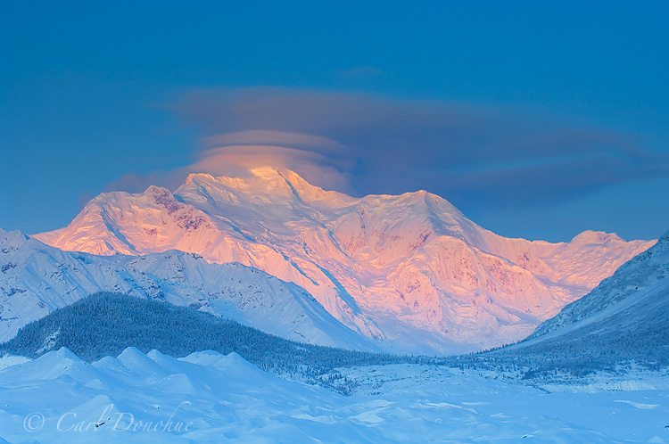 Mount Blackburn on a cold winter dawn, glowing with that gorgeous winter alpenglow. Wrangell - St. Elias National Park, Alaska.