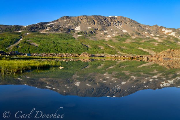 Reflection of the Chugach Mountains near Iceberg Lake, in Alaska's Wrangell - St. Elias National Park and Preserve.