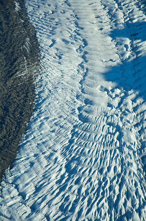 Crevasses and moraines make patterns in the Root Glacier, near Kennicott and McCarthy, Wrangell-St. Elias National Park, Alaska - aerial photo.