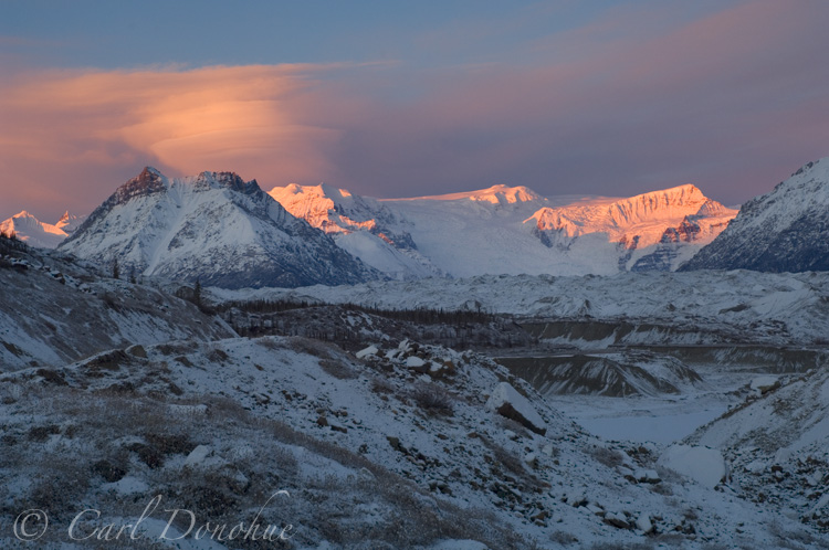 Donoho Peak, in the Wrangell Mountains, and Stairway Icefall. The Root and Kennecott Glaciers, moraine, fresh dusting of snow, winter. Wrangell St. Elias National Park, Alaska.