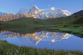 Reflections in the morning, of fresh snow or termination dust on the Wrangell Mountains, near Mount Blackburn, Wrangell-St. Elias National Park and Preserve, Alaska.